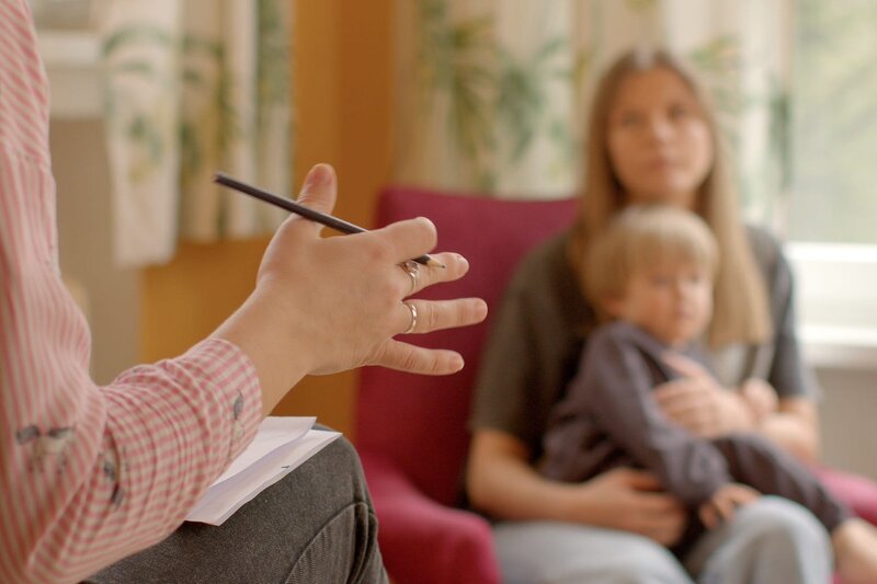 Healthcare professional consulting with patient